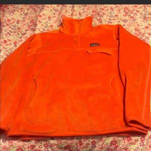 Patagonia women’s orange fleece in size large